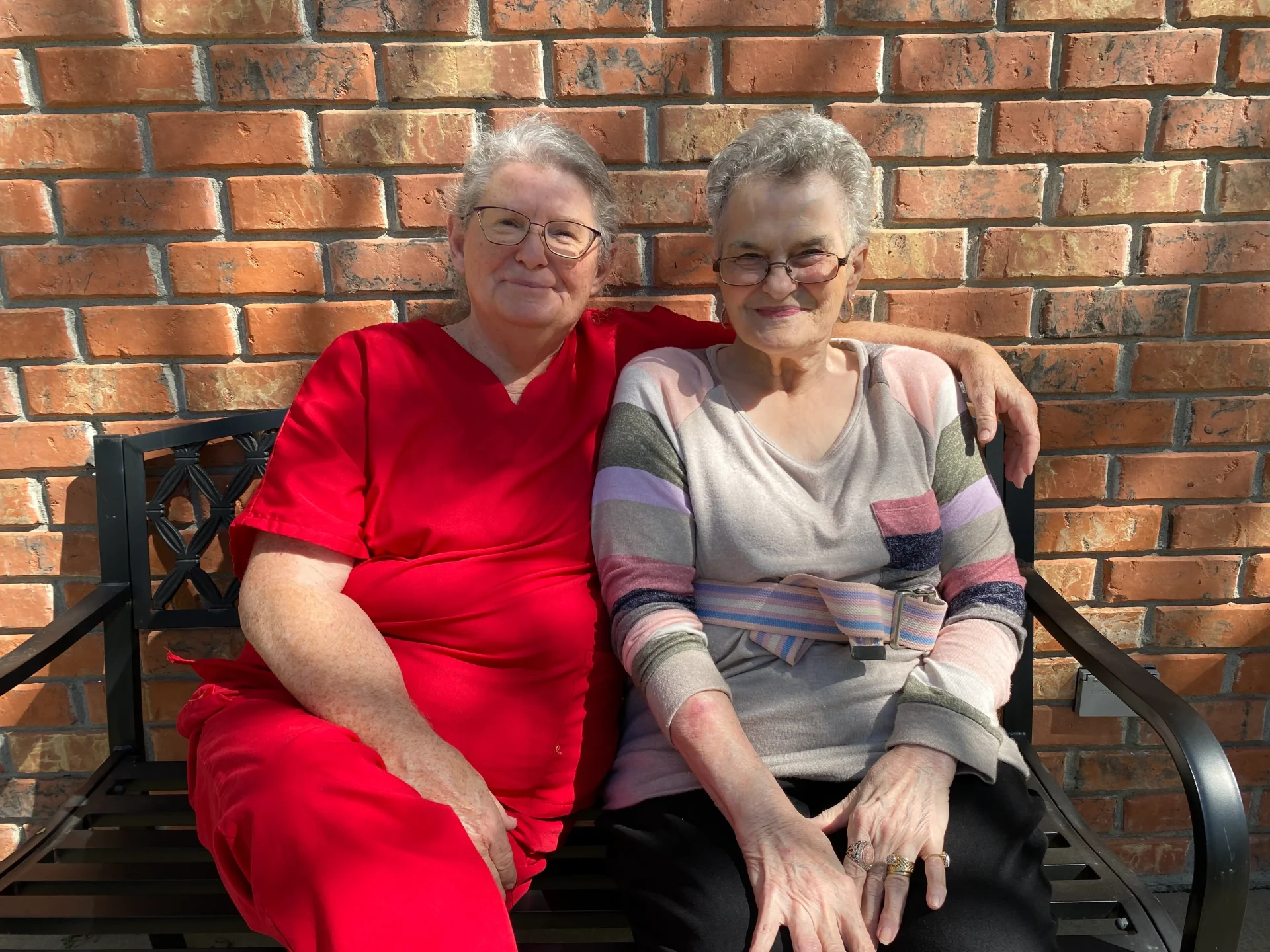 Rehab Staff And Patient Sitting On A Bench Smiling Image Image
